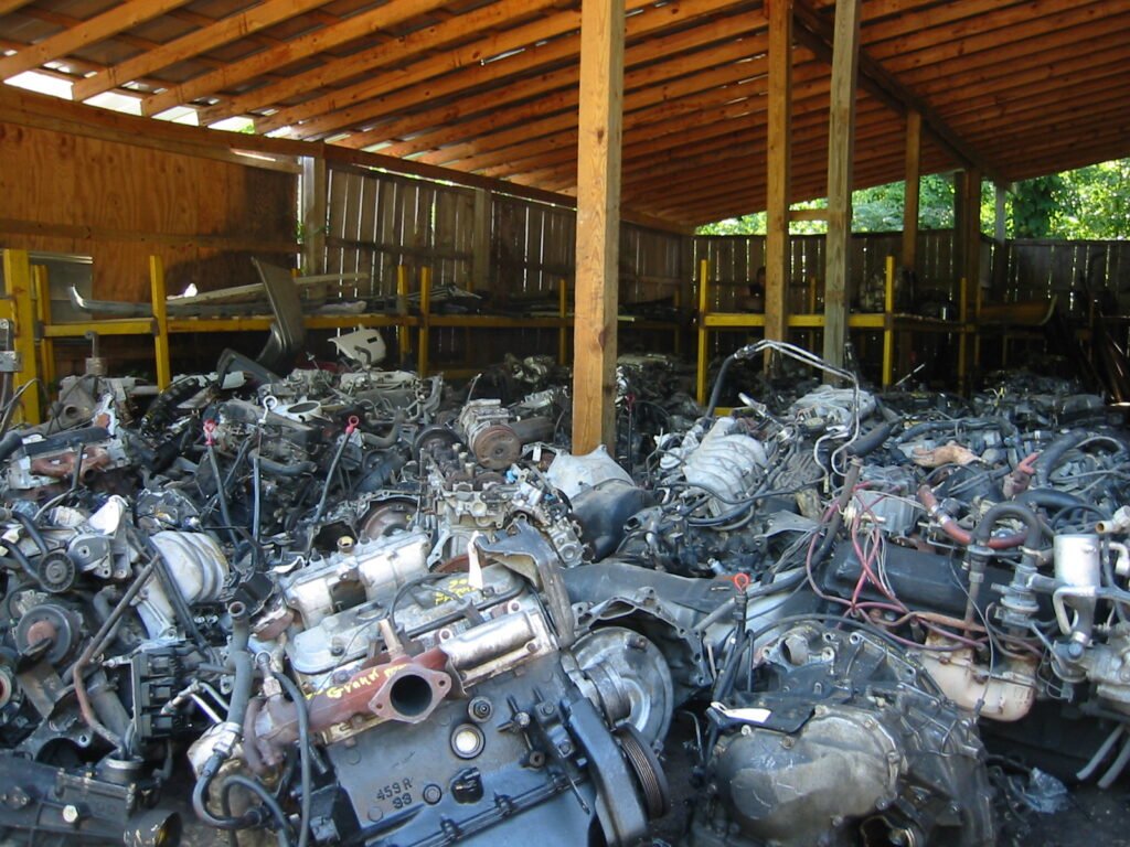 Scrapped automobile engines stored at a junkyard in Nashville, Tennessee, photographed by Philip Kromer.