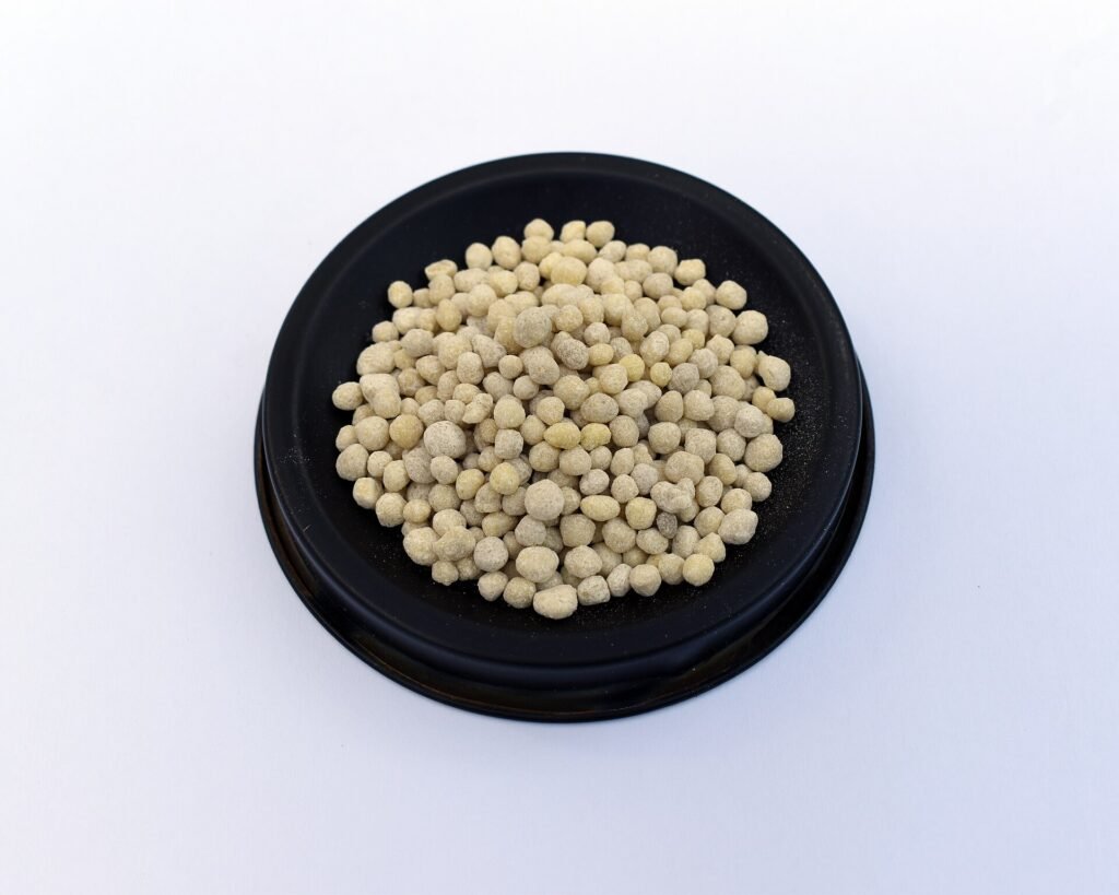 DAP fertiliser granules photographed in close-up.