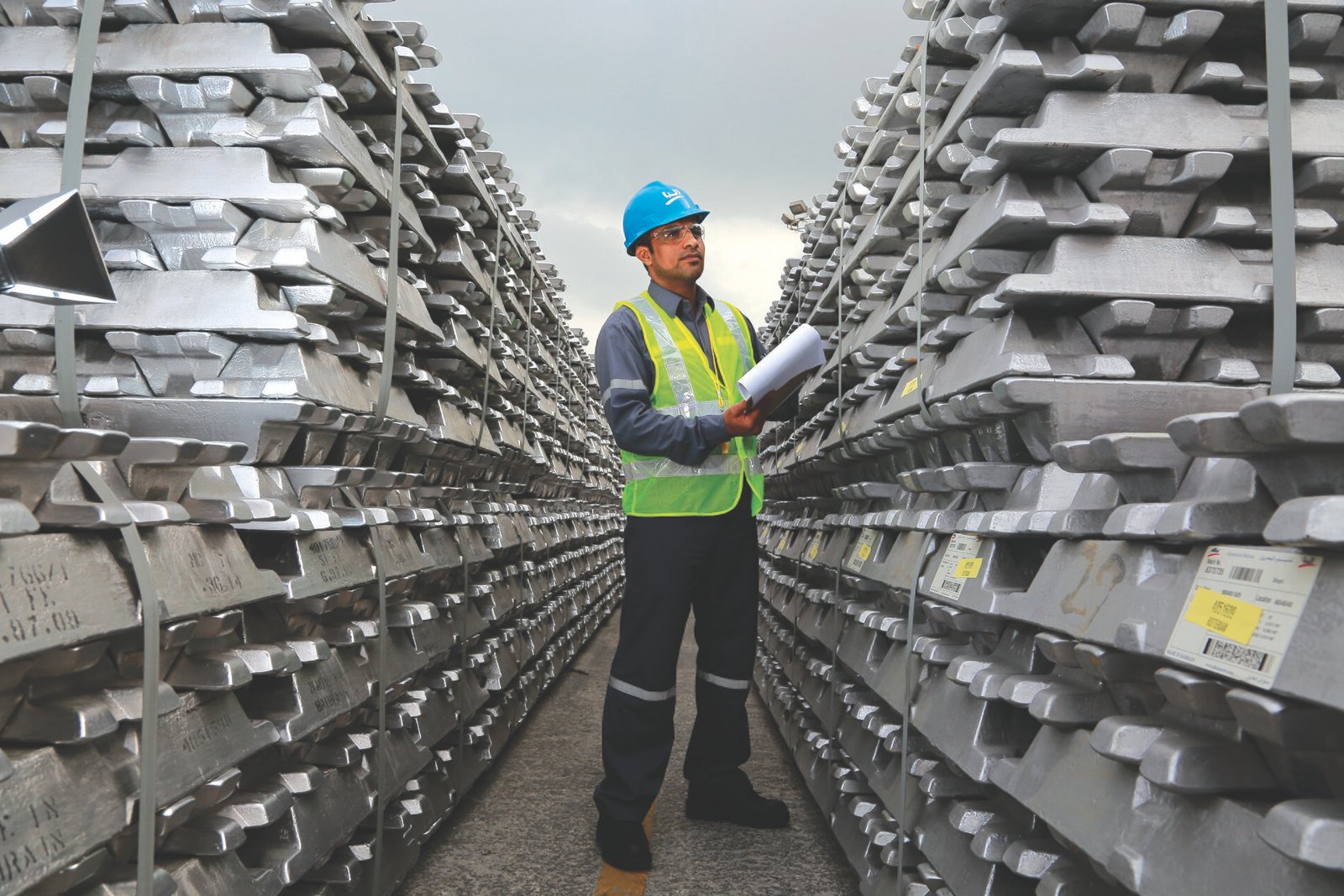 Stacks of aluminium ingots at an industrial facility.