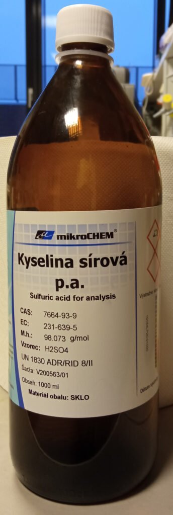 A labelled laboratory bottle of sulphuric acid.